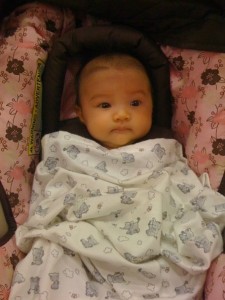Hazel in her car seat