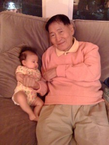 Hazel hanging on the couch with her great grandfather